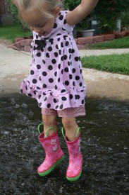 Girl Jumping In Puddle